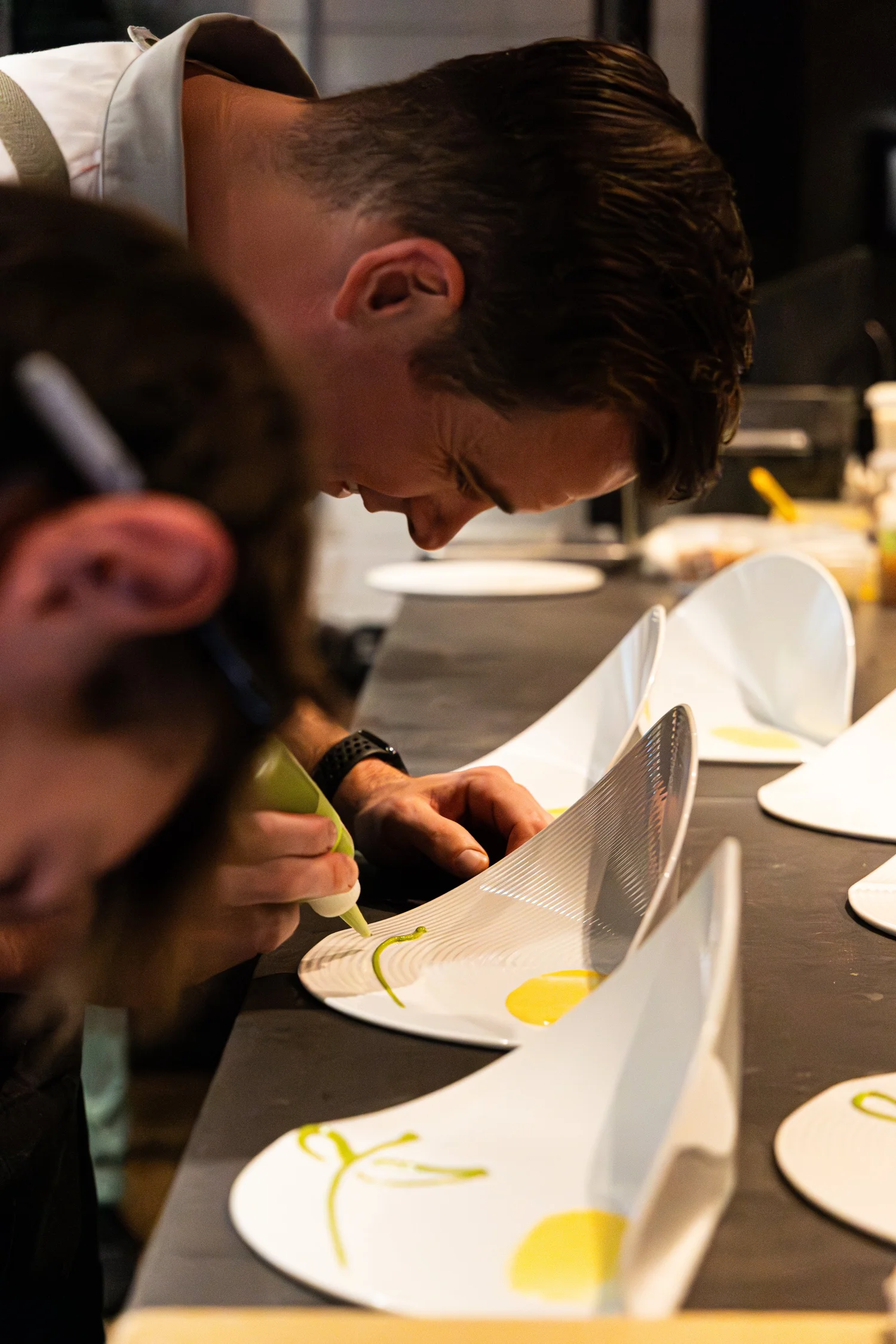 Chef Joey Ward plating a dish